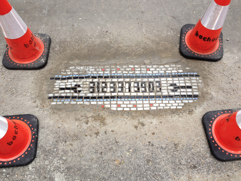 Illustration for article titled There's a Hero Repairing Chicago's Horrible Potholes With Mosaics